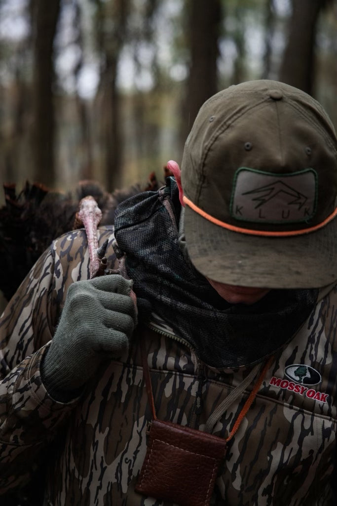 A turkey hunter carrying this past springs harvest using our turkey mouth call