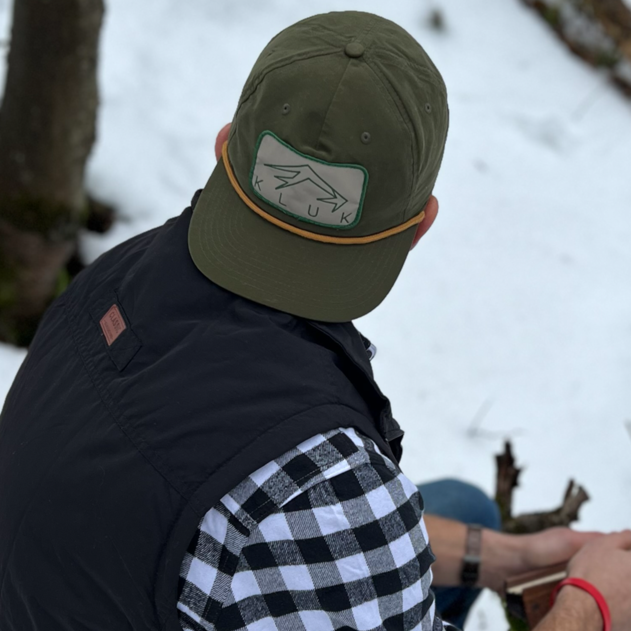 The Loden Gold Pap Hat showcasing the logo up close